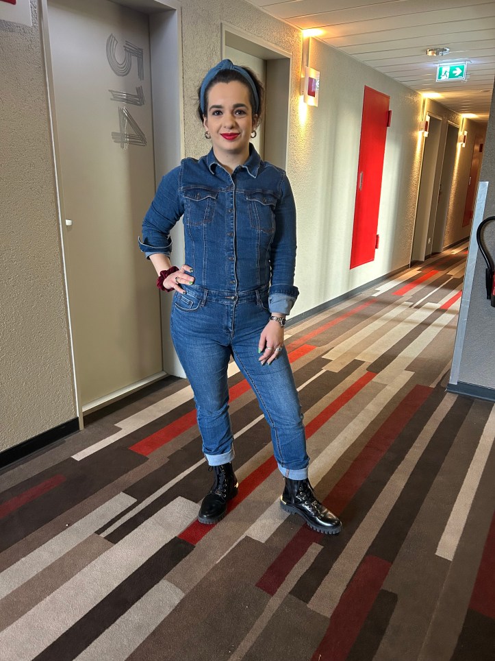 Denim all over with red accents.