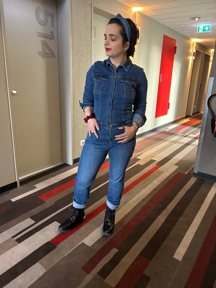 Denim all over with red accents.