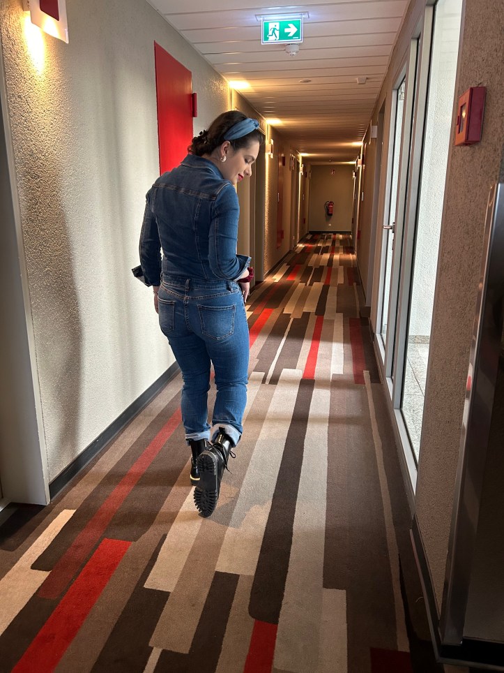 Denim all over with red accents.