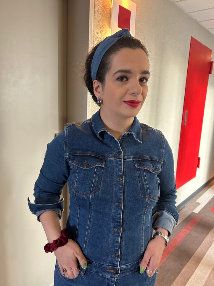 Denim all over with red accents.